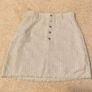 Beige button up mini skirt with pockets
